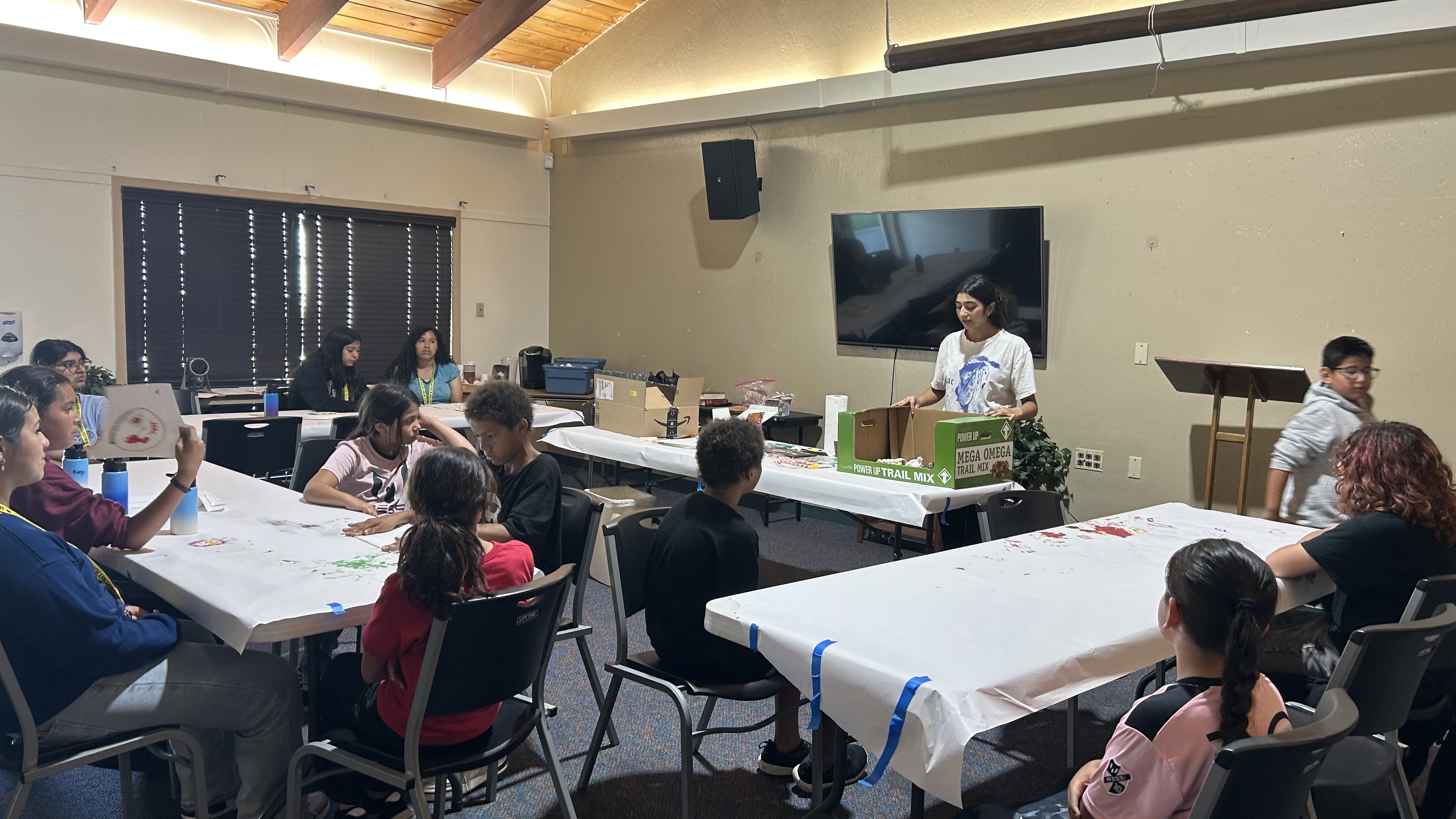 Kids creating art together at a community session