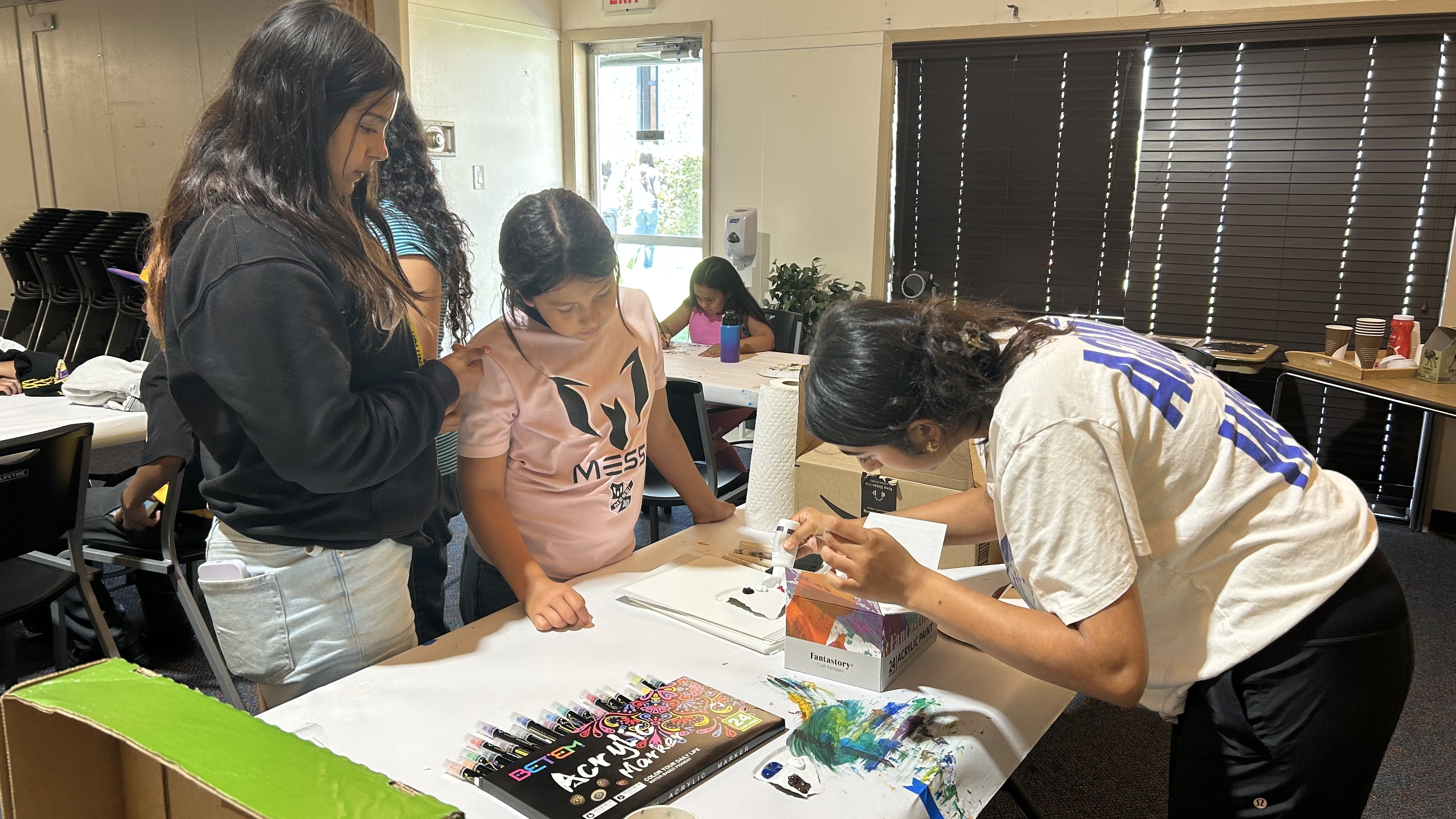 Students painting together