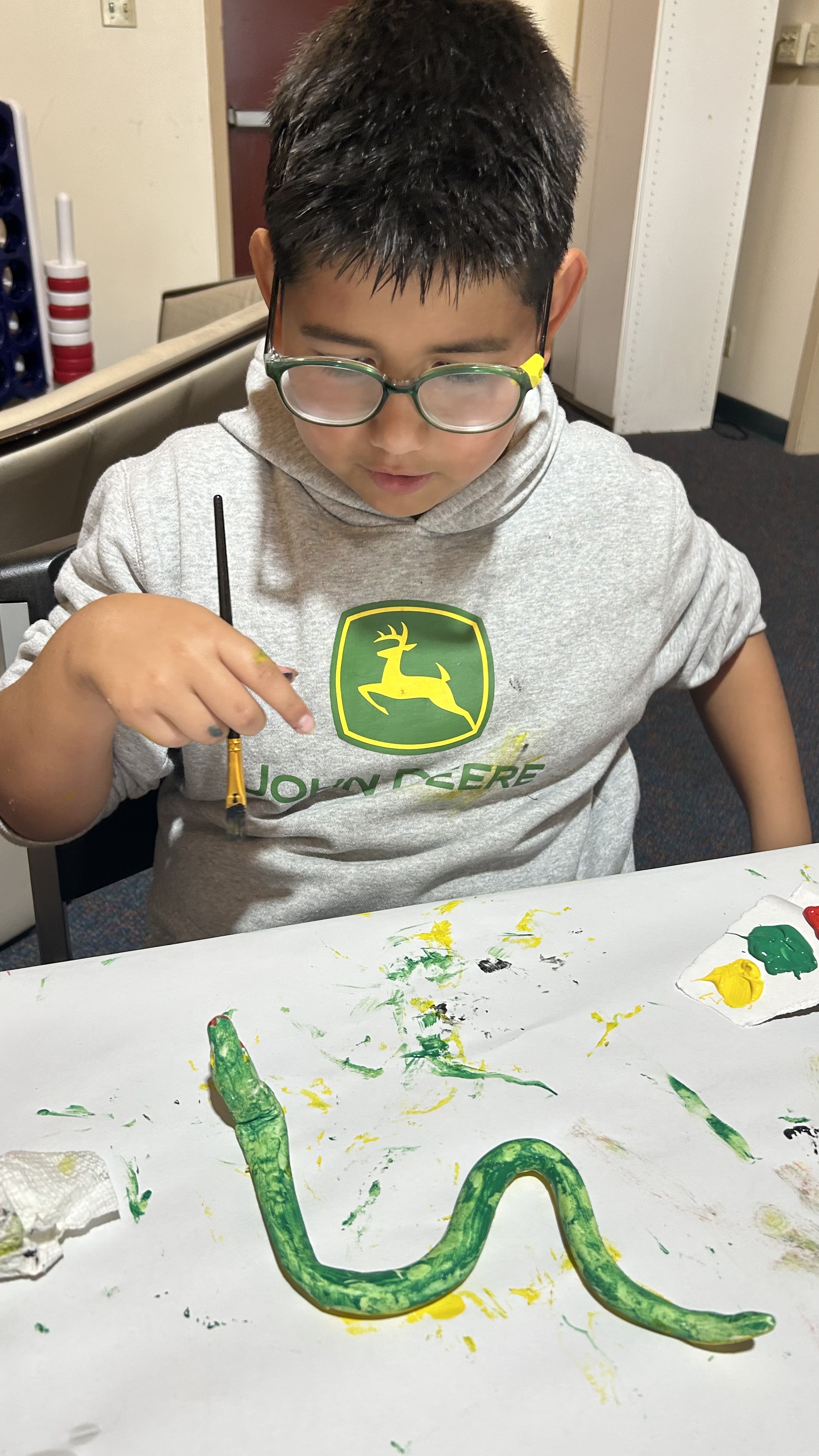 Student focused on painting