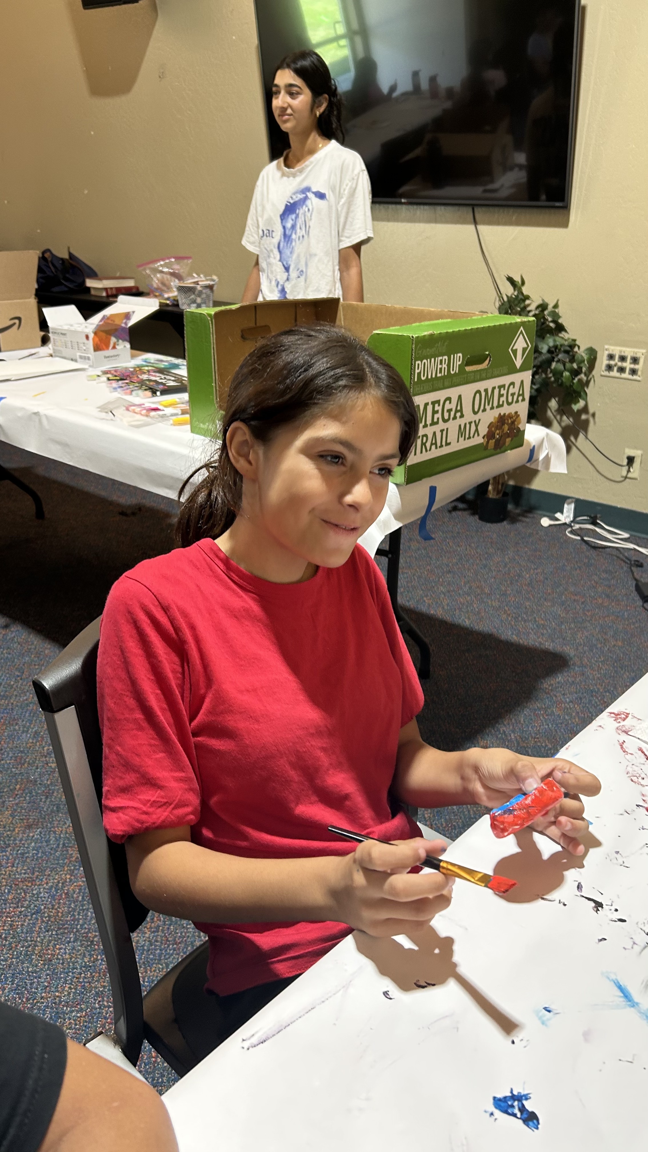 Student painting during a session