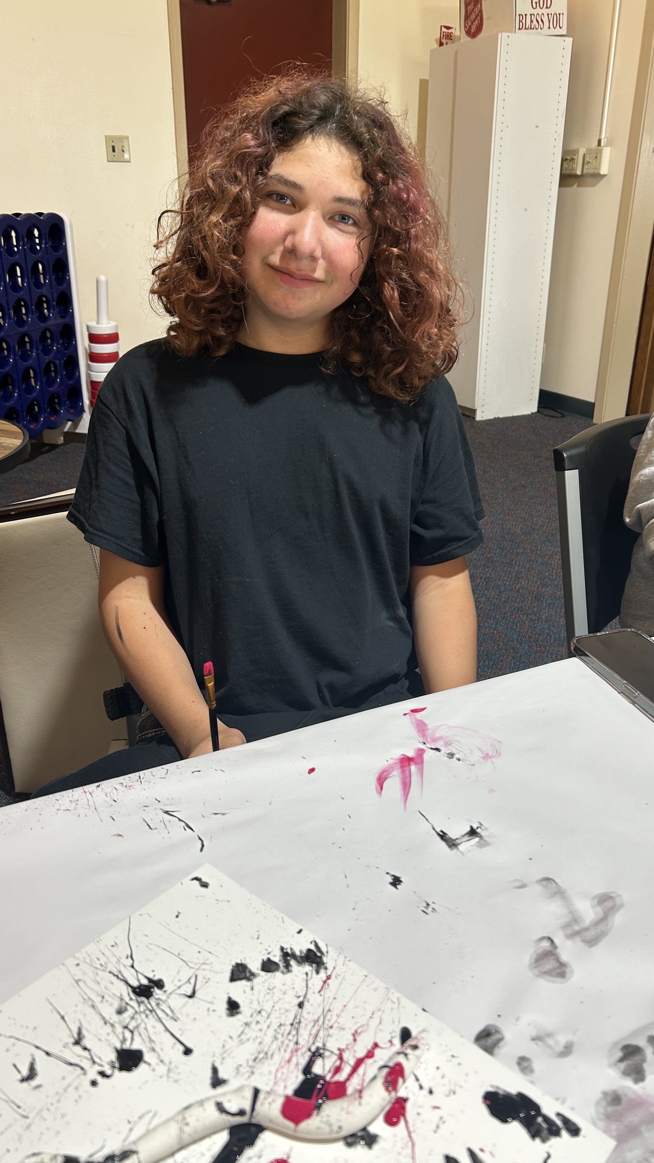 Student posing proudly after a session